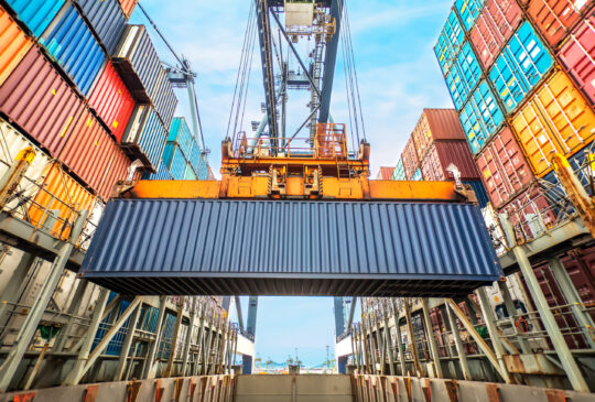 Container,Loading,In,A,Cargo,Freight,Ship,With,Industrial,Crane.